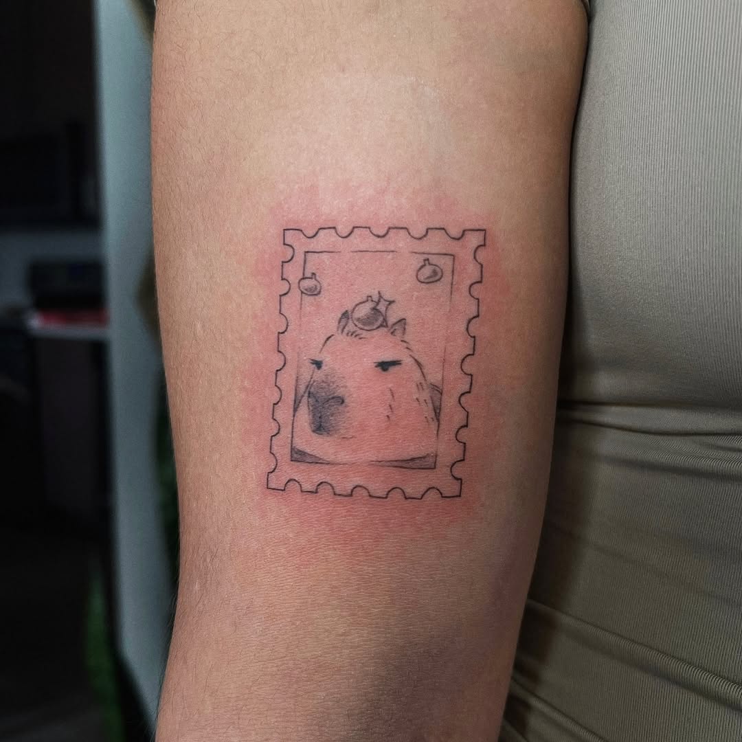 Adorable capybara tattoo in stamp design