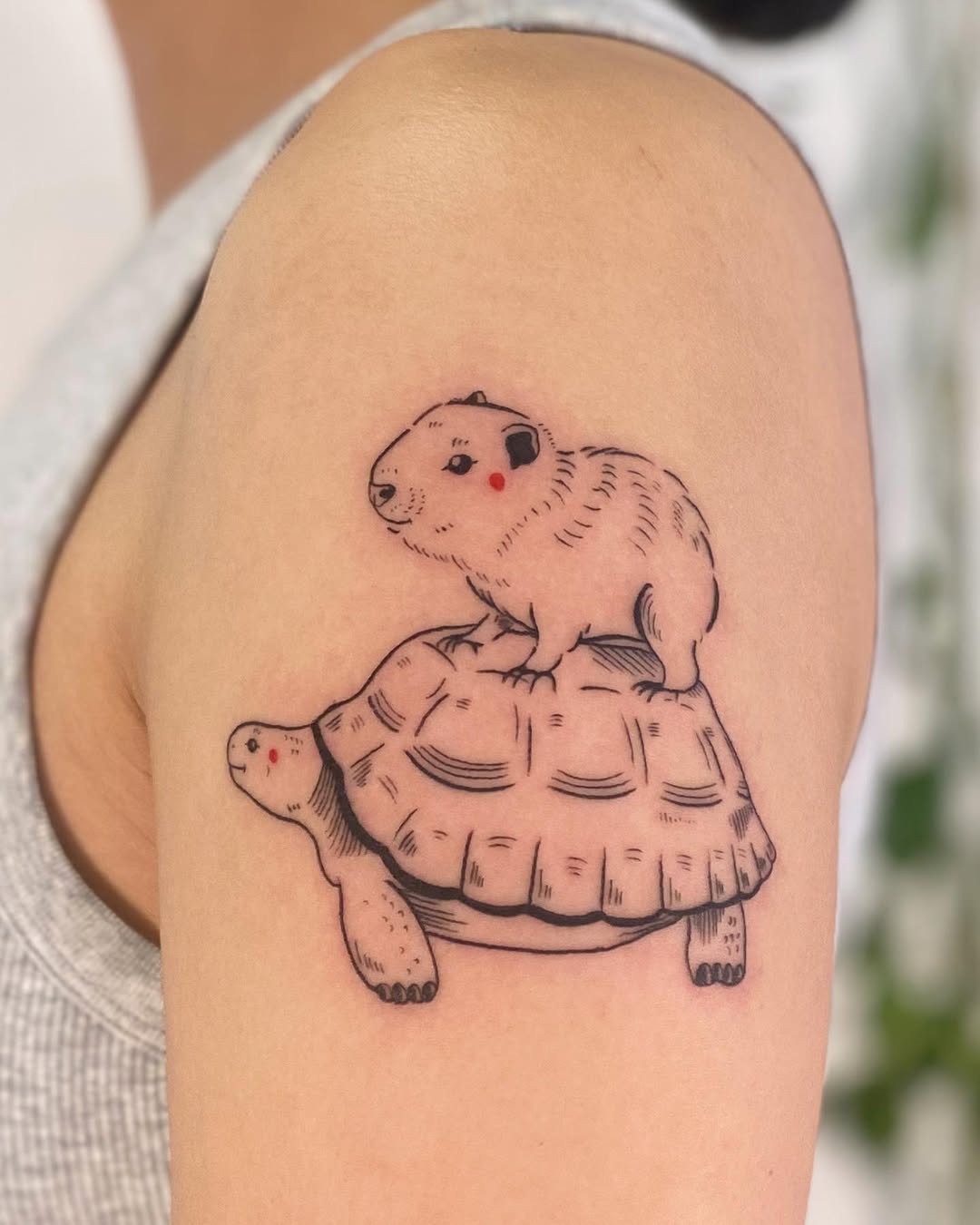 Whimsical capybara and tortoise tattoo design