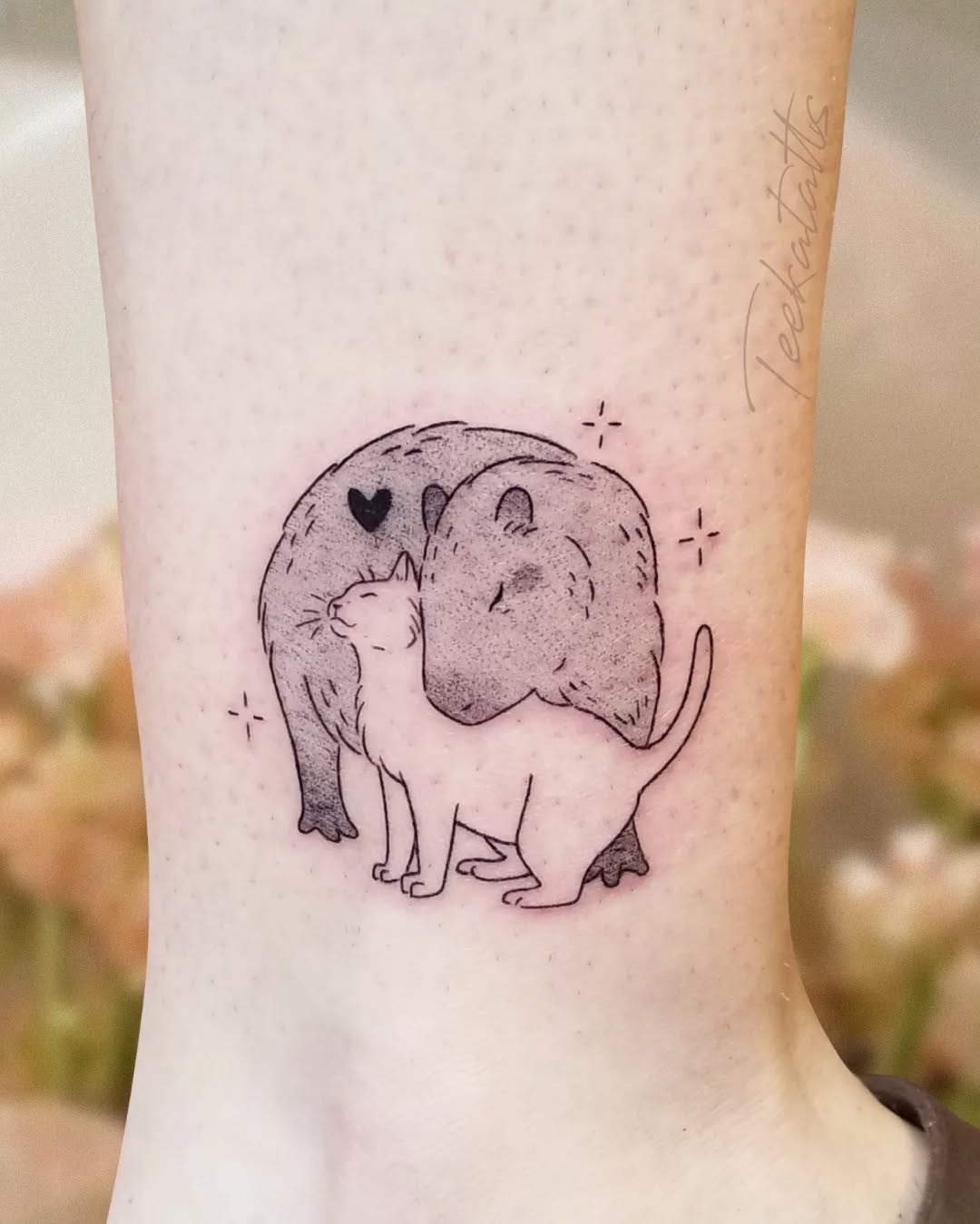 Charming capybara and cat love tattoo design