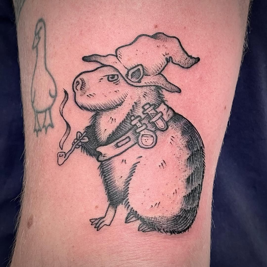 Charming capybara with wizard hat tattoo