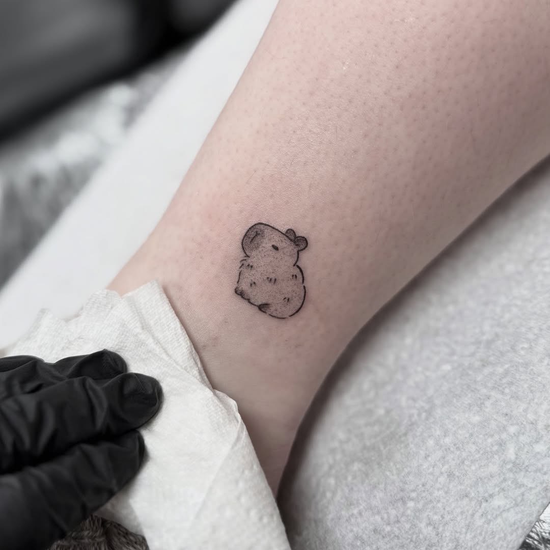 Charming small capybara tattoo design