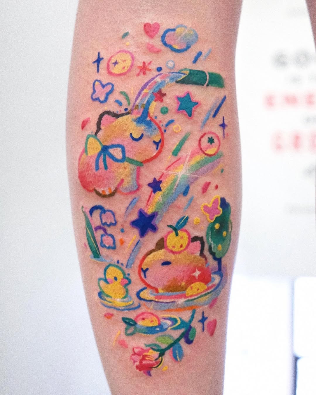 Vibrant capybara-themed whimsical tattoo art