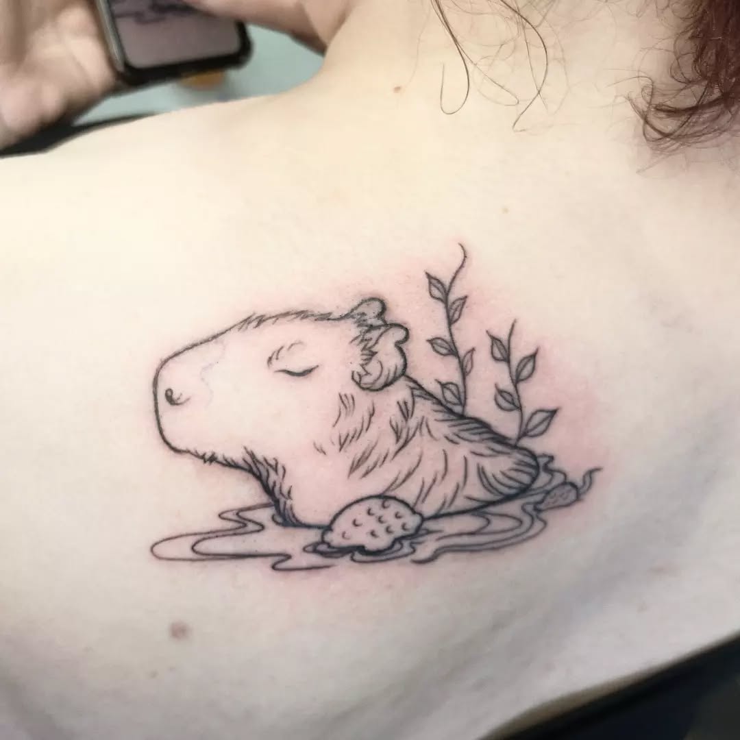 Charming capybara tattoo exuding calm vibes
