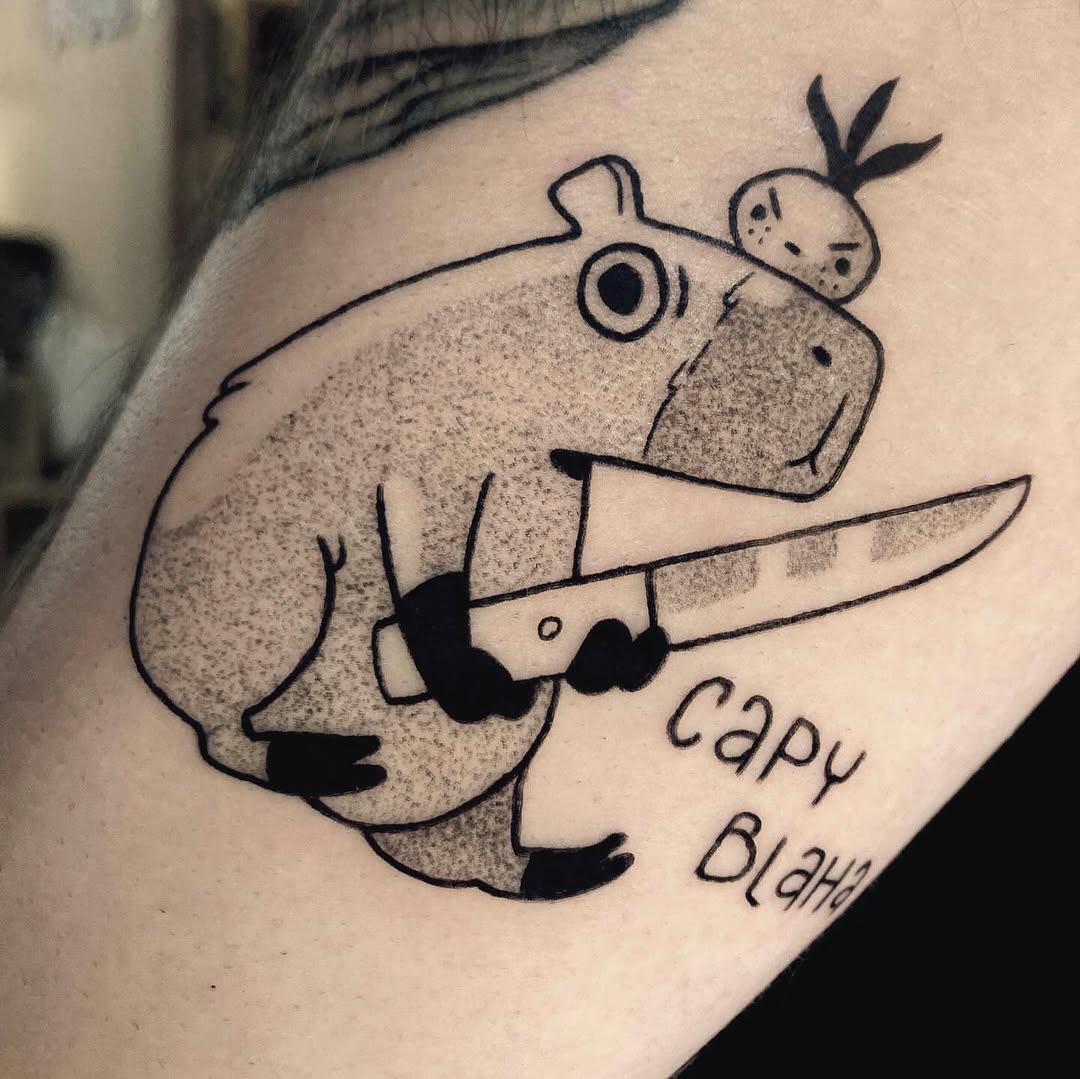 Whimsical Capybara Tattoo with Knife