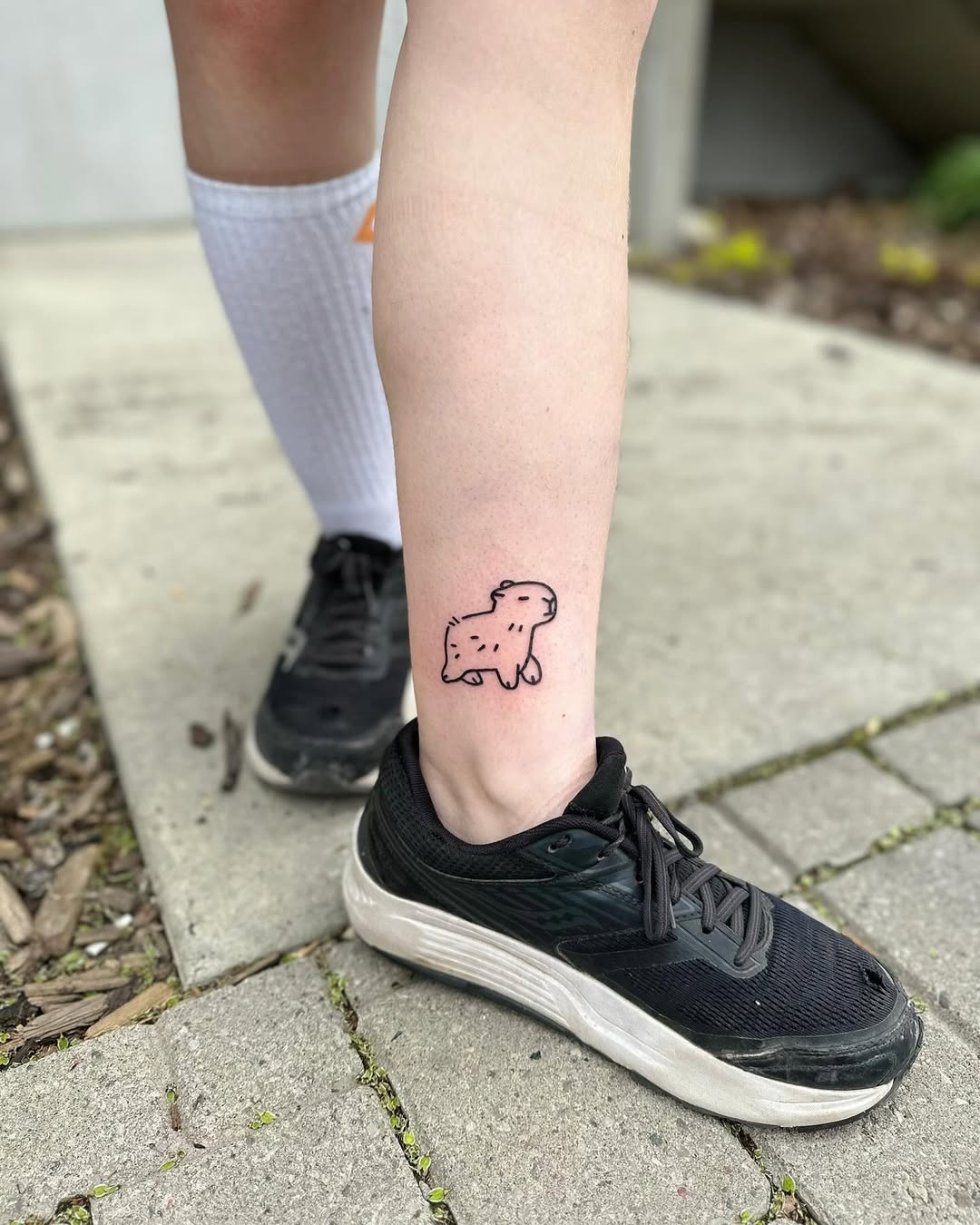 Cute capybara tattoo on the leg