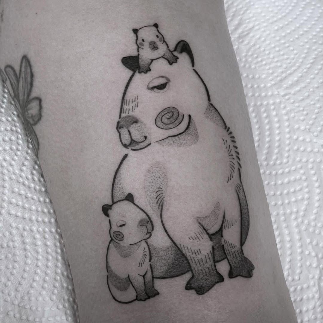Charming capybara family tattoo design