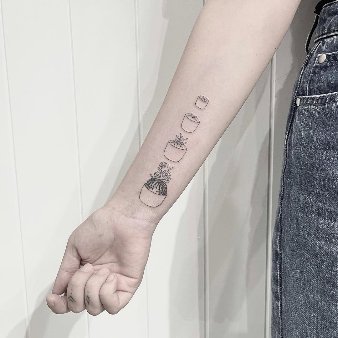 Charming potted plant tattoos for growth lovers
