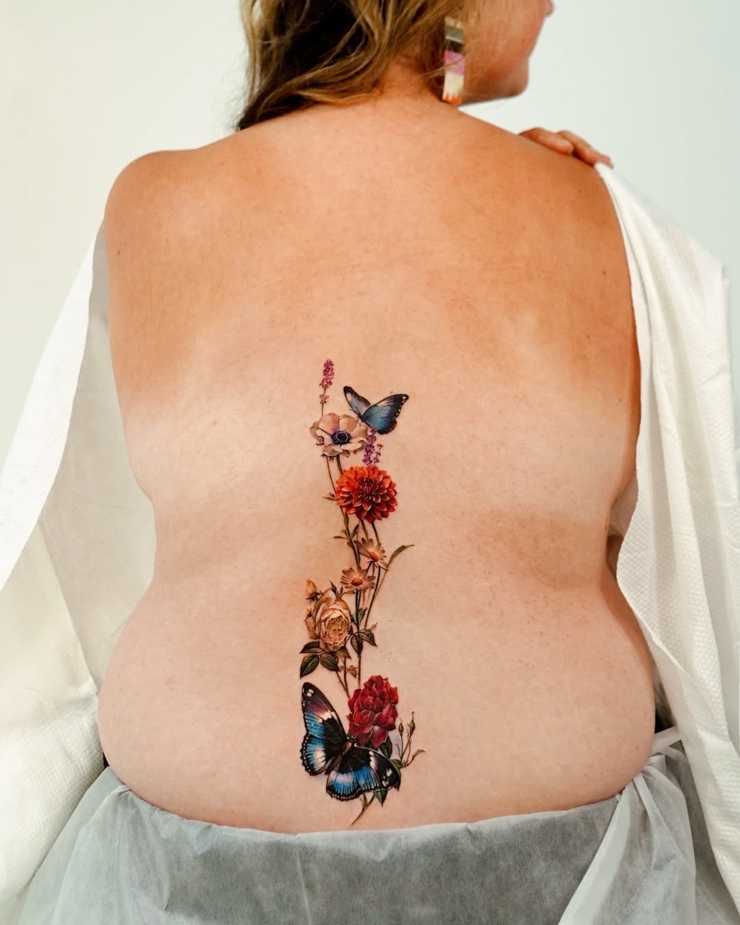 Beautiful floral and butterfly growth tattoo design