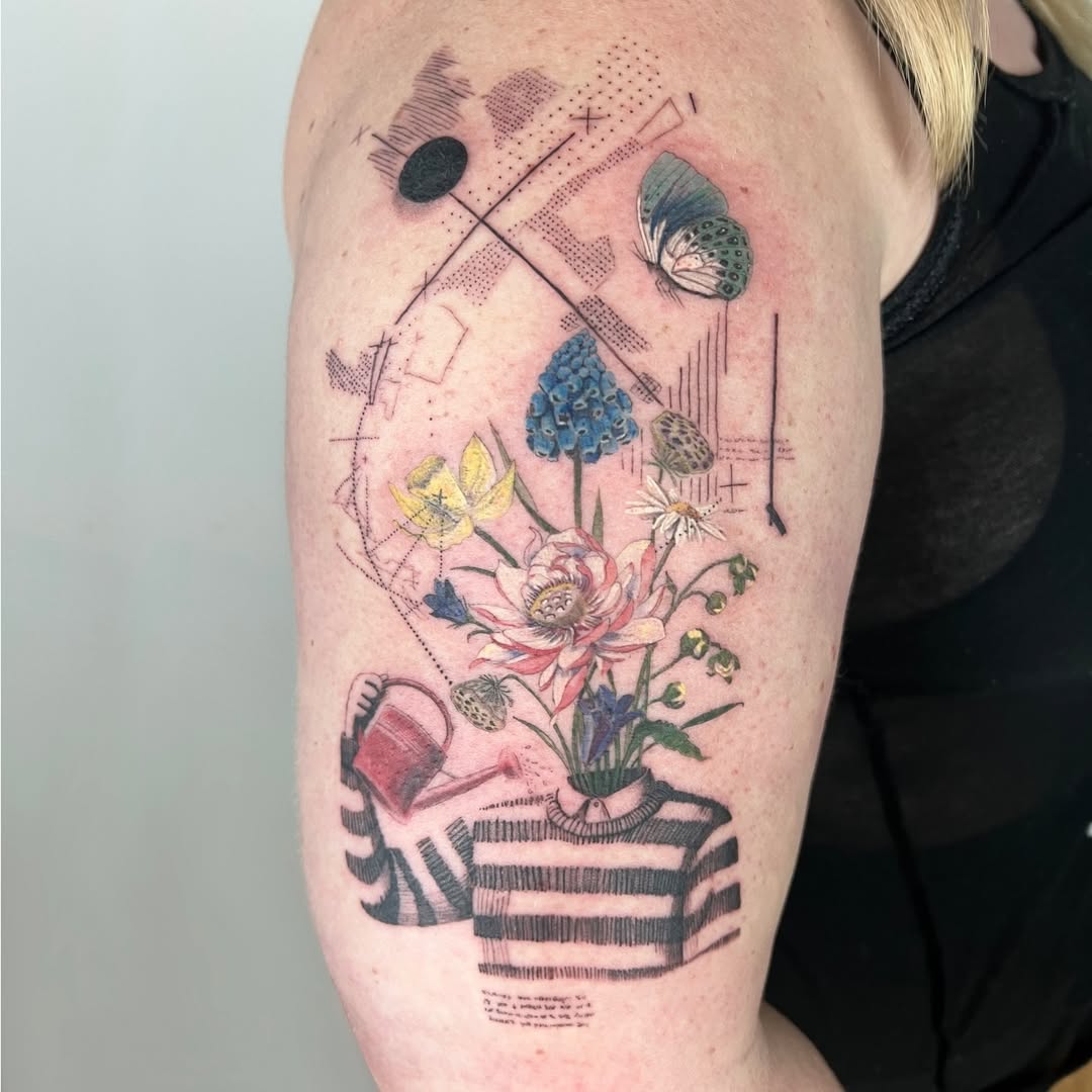 Artful floral arrangement tattoo with playful elements