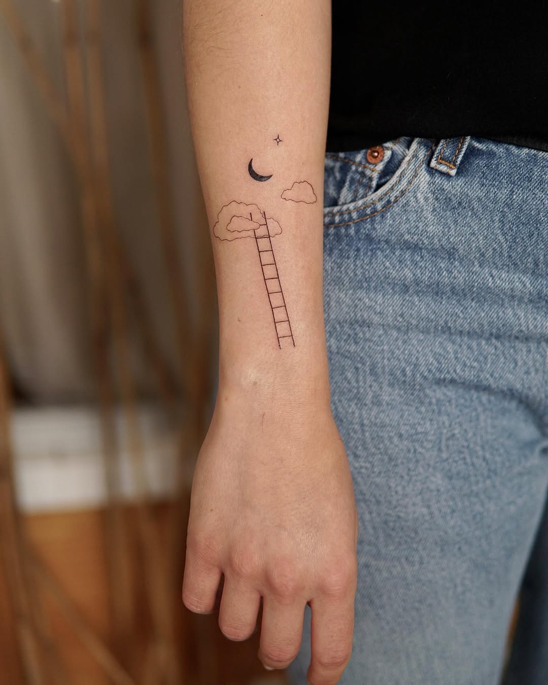 Whimsical ladder tattoo symbolizing personal growth