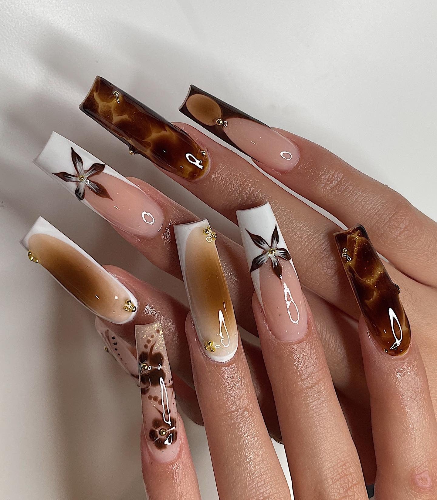9. Autumn Florals and Tortoiseshell (Thanksgiving Nail Ideas)