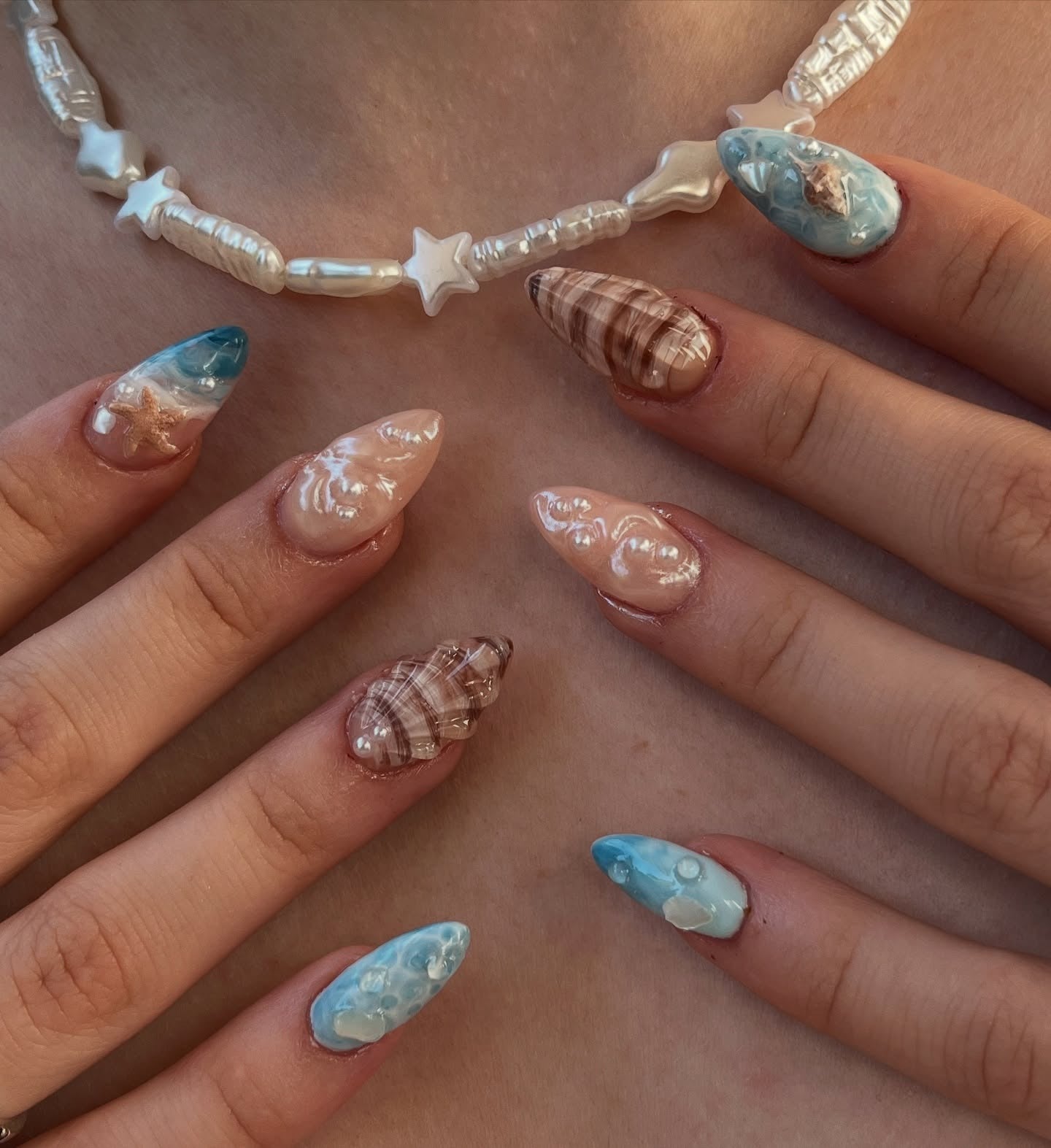 3. Ocean Wave and Shell Texture Nails (Beach Nail Ideas)