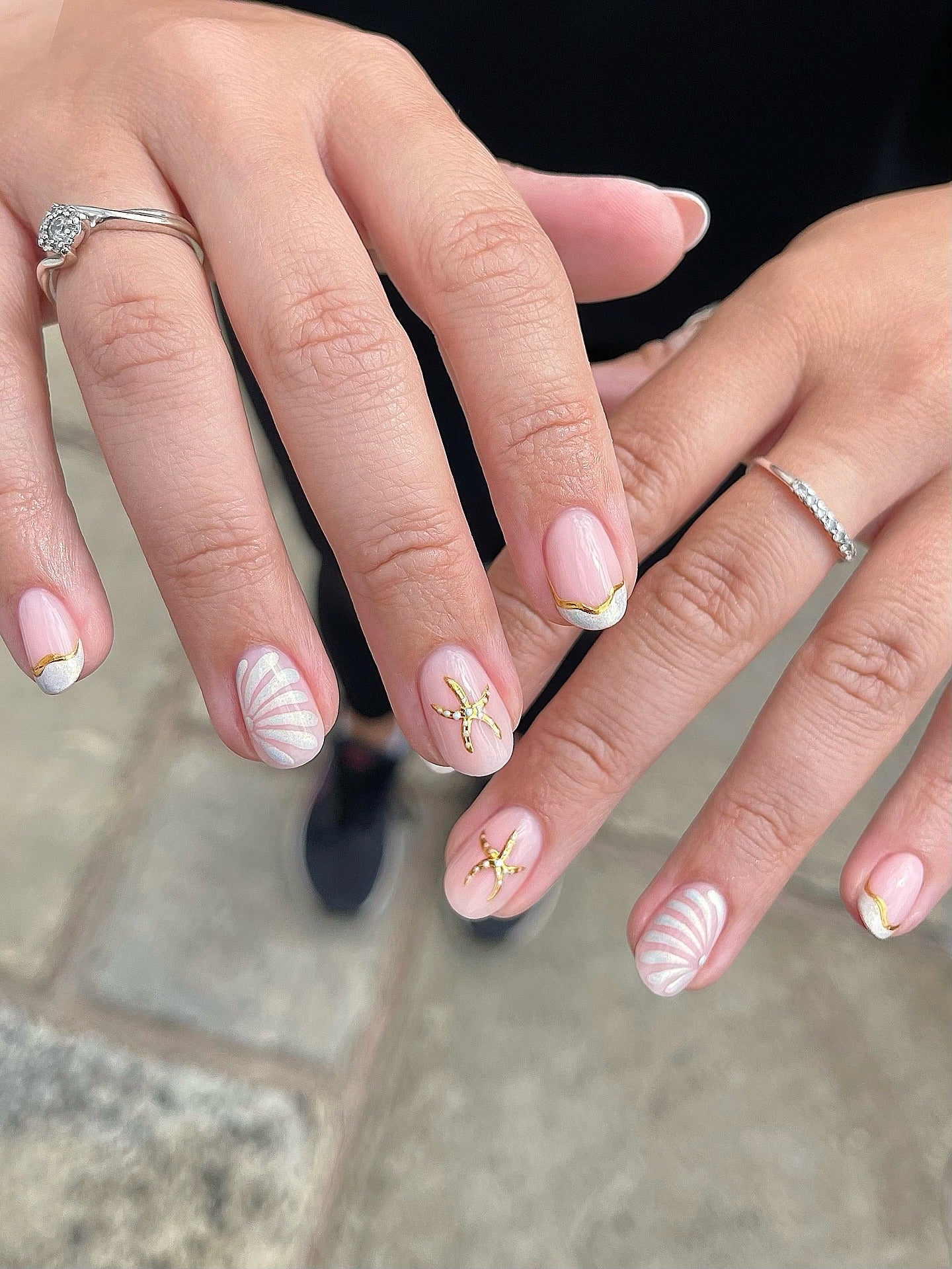 5. Minimalist Starfish and Shell Accent Nails (Beach Nail Ideas)