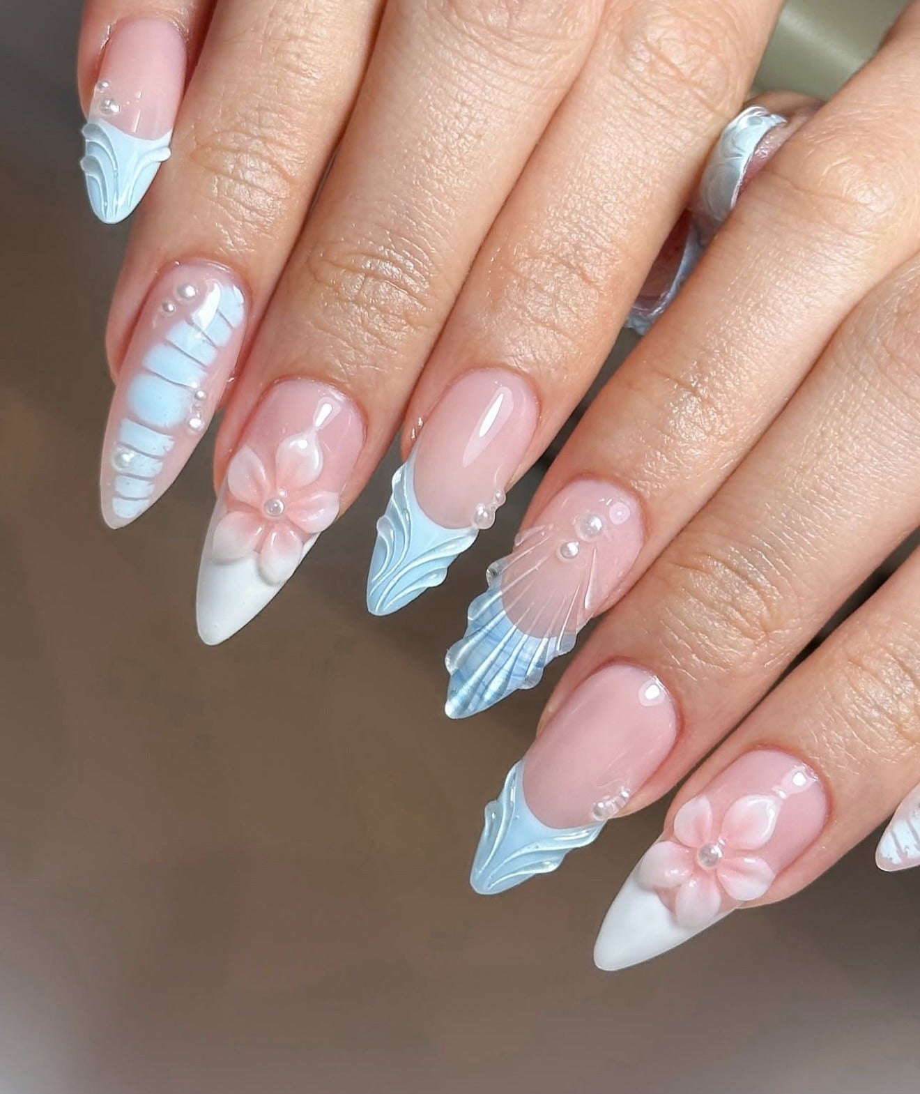 11. Pastel Seashell and Floral Sculpted Nails (Beach Nail Ideas)