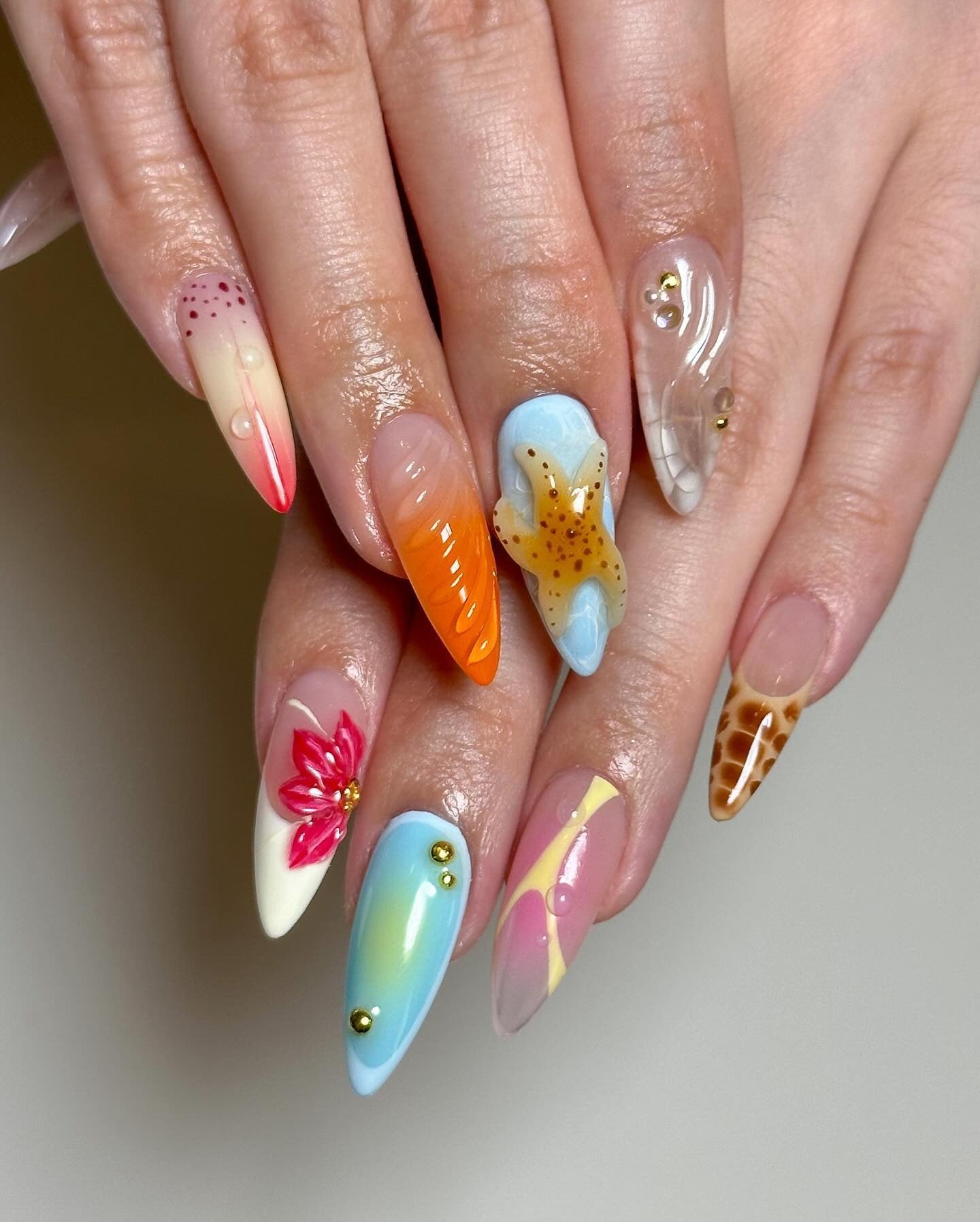 15. Playful Ocean Mix and Starfish Nails (Beach Nail Ideas)