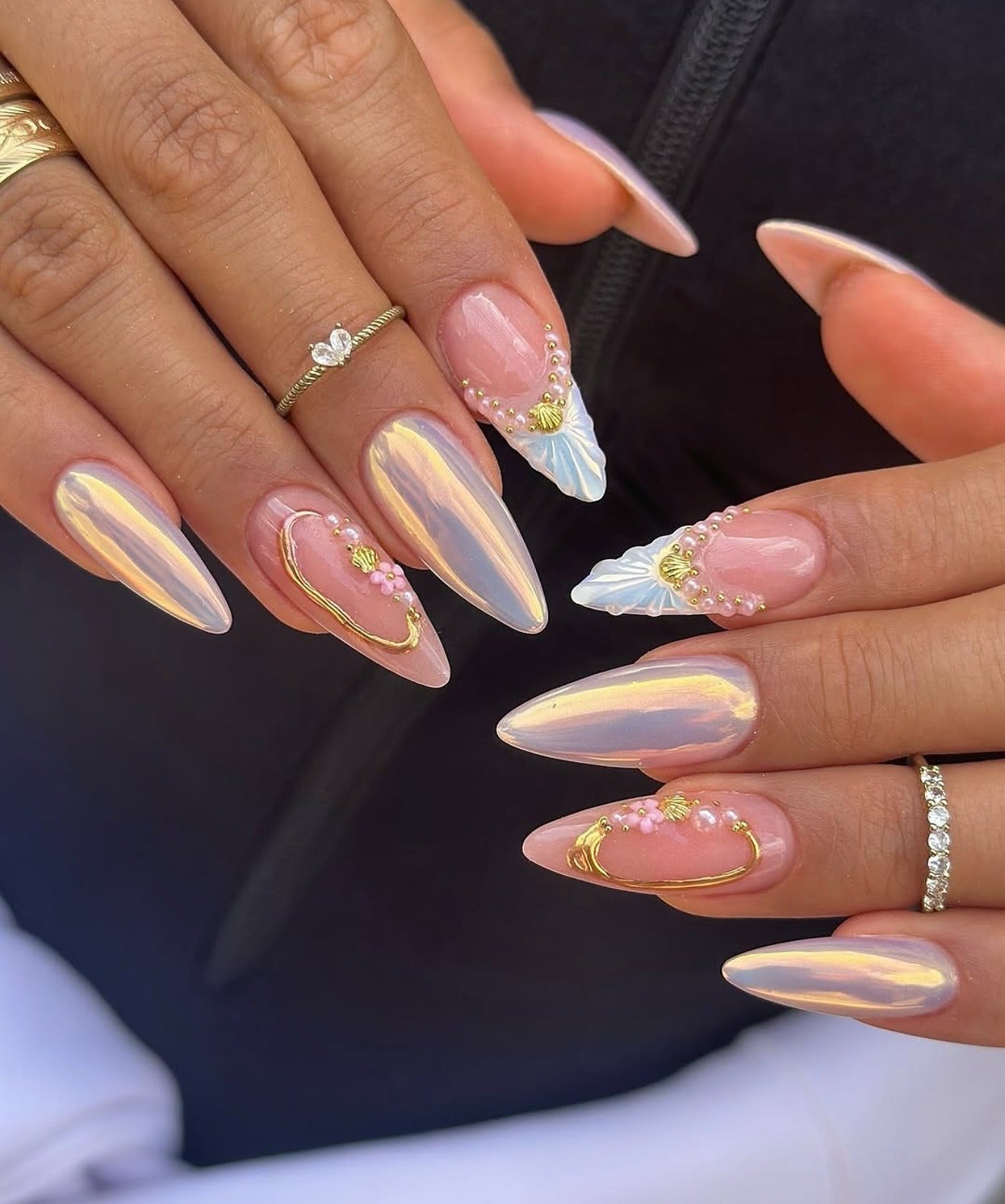 14. Pearlescent Shell Elegance with Gold Accents (Beach Nail Ideas)