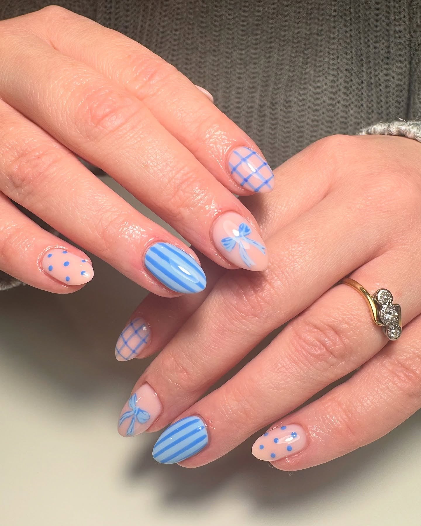 8. Playful Blue Bow and Pattern Nail Art (Light Blue Nail Ideas)