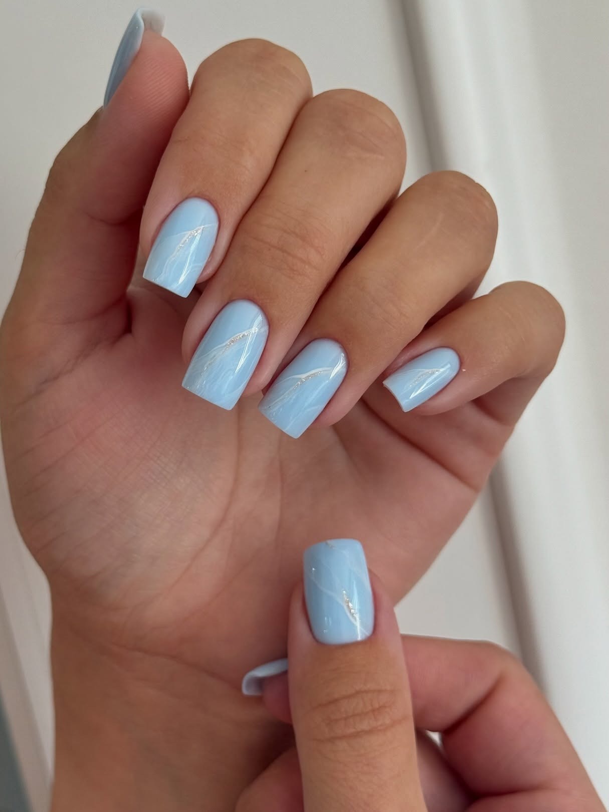 17. Glossy Blue Square Nails with Subtle Marble (Light Blue Nail Ideas)