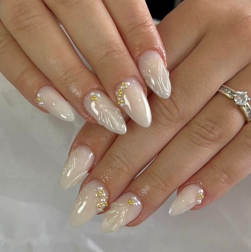 2. Elegant Pearl White with Crystal Detailing (Holiday Nail Ideas)