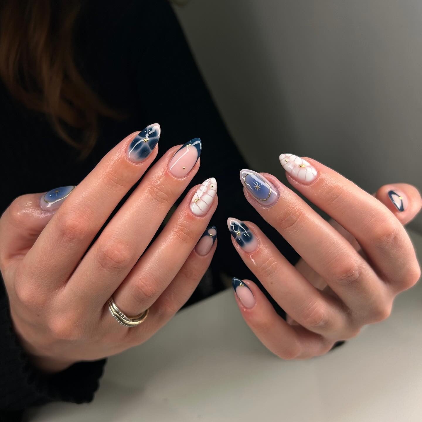 3. Midnight Sky with Starry Accents (Holiday Nail Ideas)