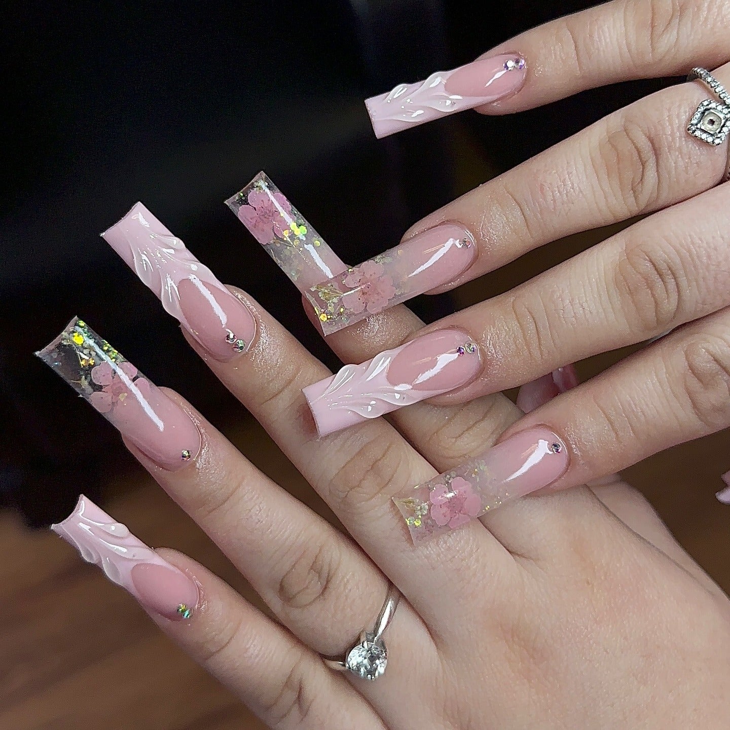 10. Long Coffin Pink Nails with Encased Florals (Light Pink Nail Ideas)