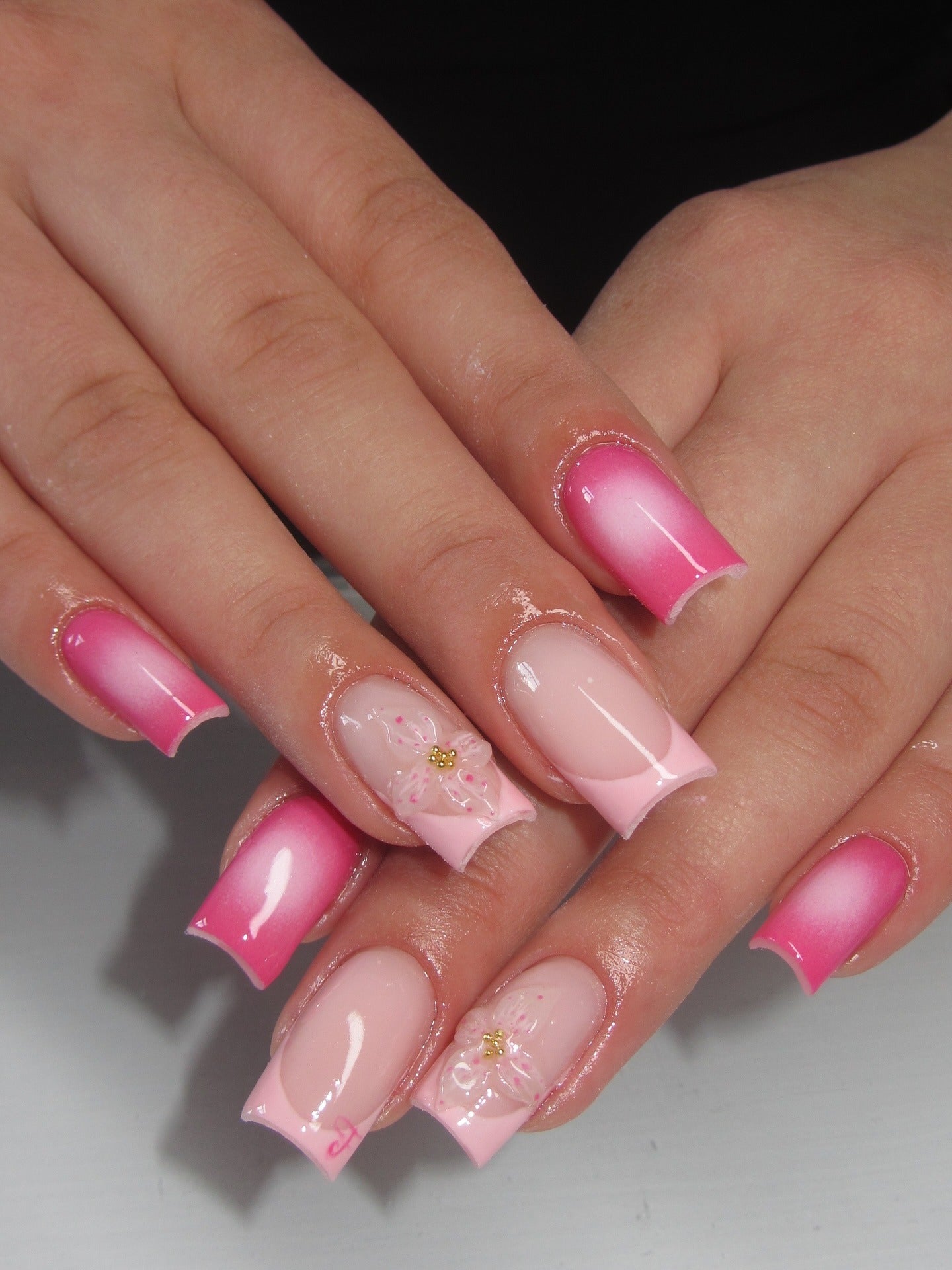 6. Gradient Pink Ombre with Floral Accents (Light Pink Nail Ideas)